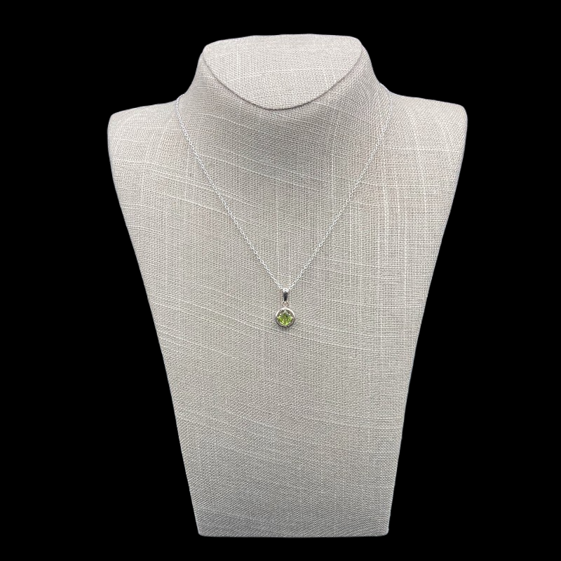 Sterling Silver And Green Peridot Necklace, The Pendant Is Round In Shaped And Bright Green.