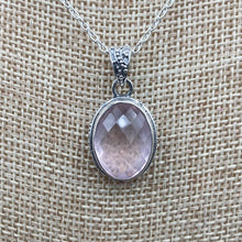 Load image into Gallery viewer, Close Up Of Rose Quartz Pendant, It Is Light Pink In Color And Oval In Shape
