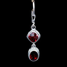 Load image into Gallery viewer, Close Up Of Sterling Silver Oval And Diamond Shaped Garnett Gemstone Dangle Earrings, Gemstones Are a Deep Red
