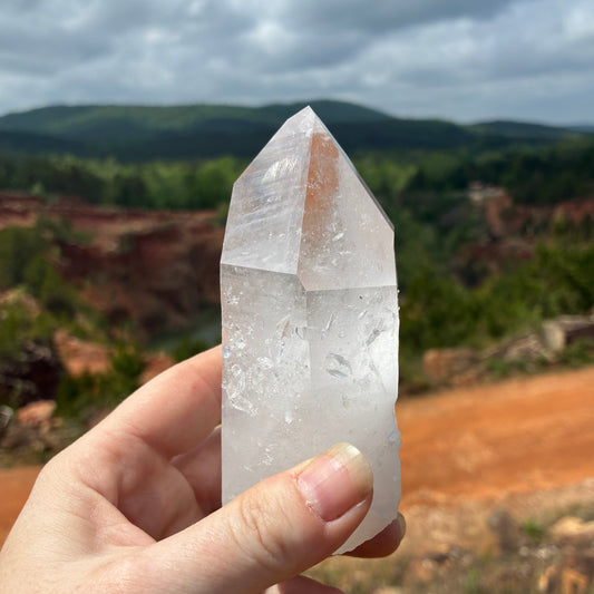 This is the front side of this Quartz crystal point. It is half clear, half milky, and has fairy dust on it.