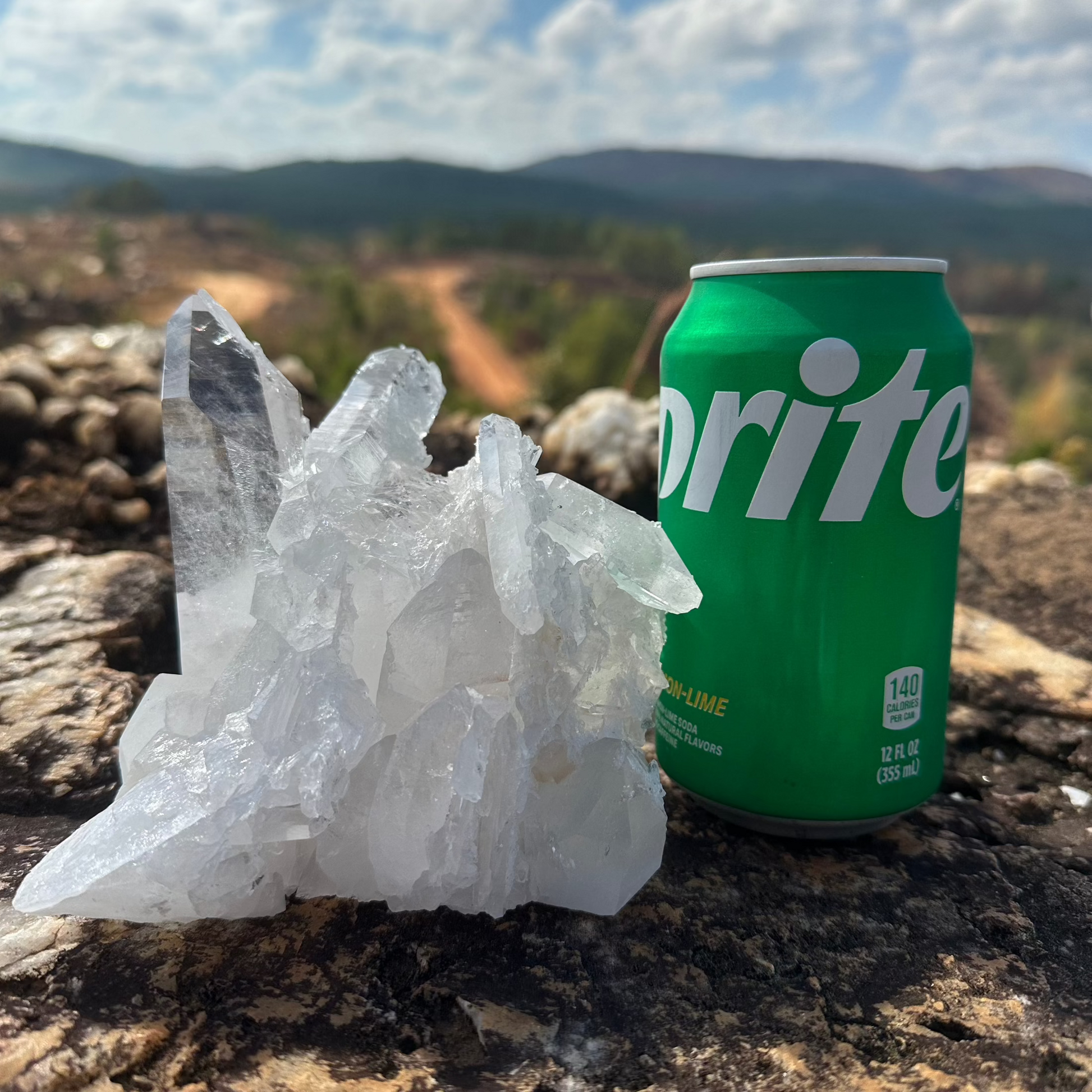 Quartz Crystal Cluster With Canned Soft Drink To Show Size