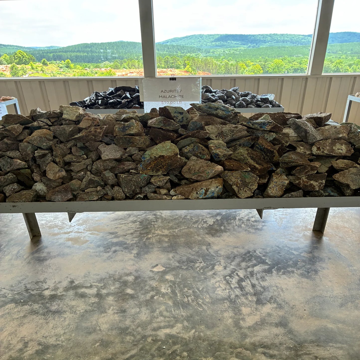 Bulk view of Azurite Malachite on a table outdoors.