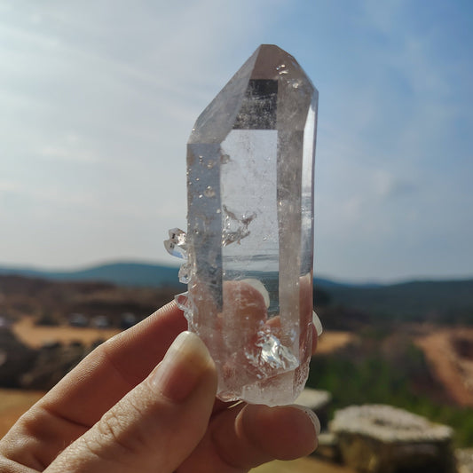 This is a medium sized, water-clear single Quartz crystal point.