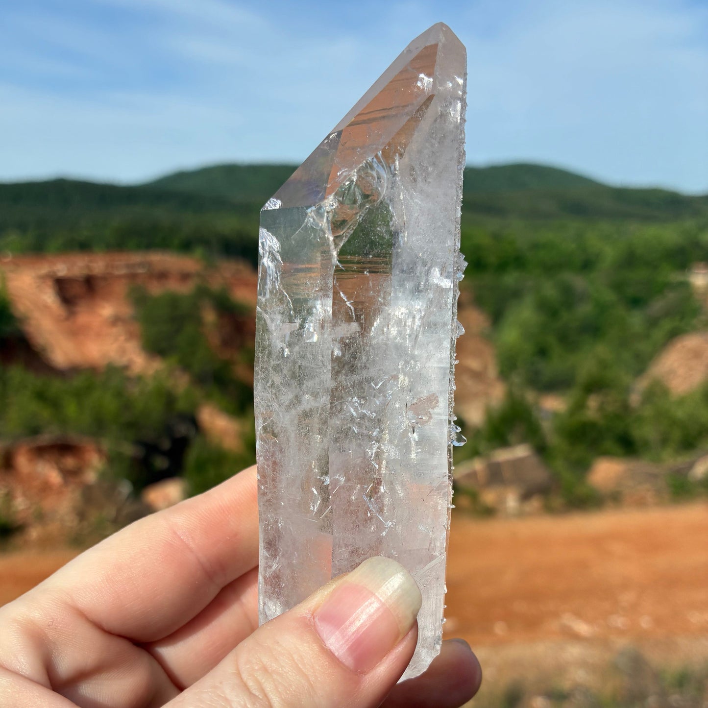 This is the left side of this single Quartz crystal point, outdoors in front of the mine.