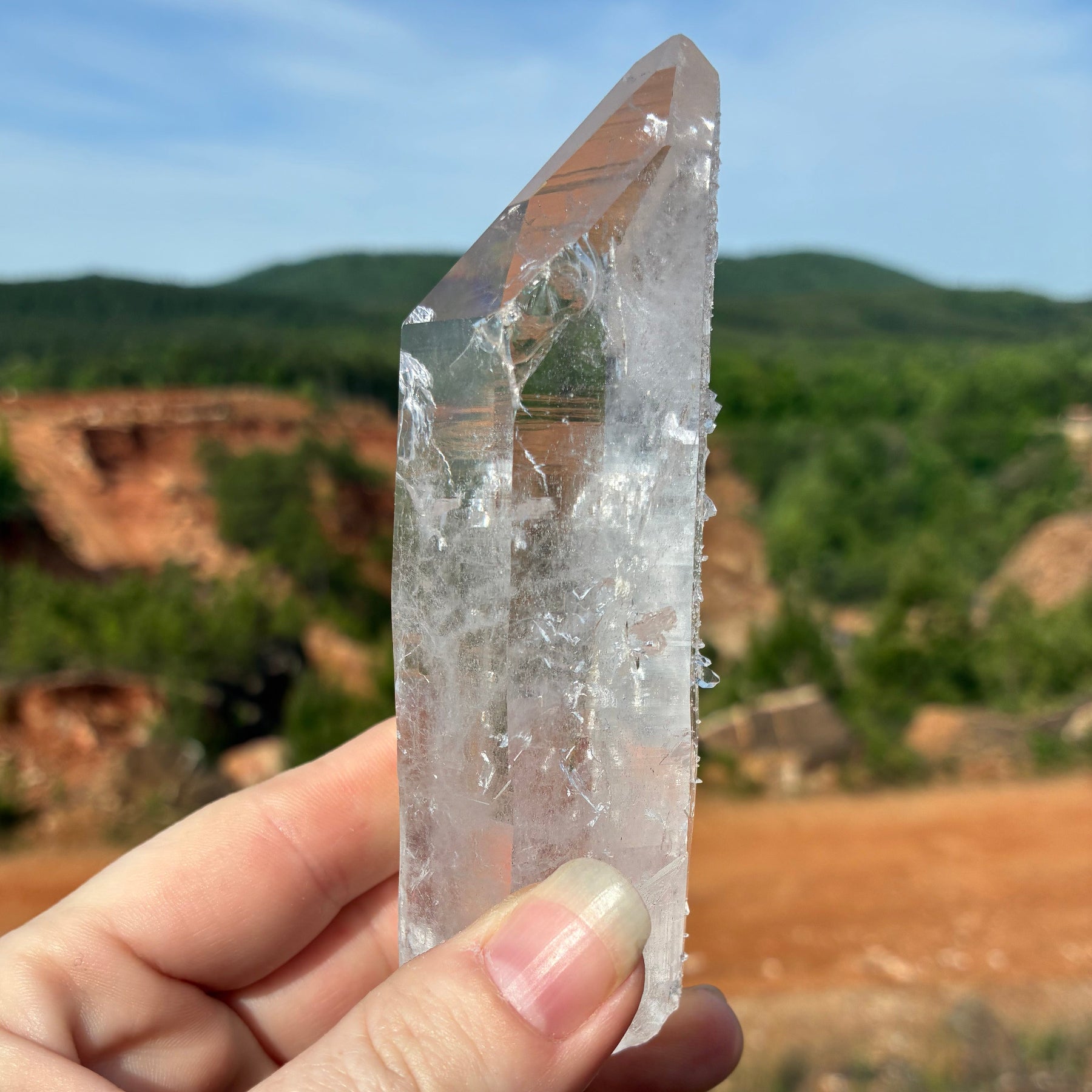 This is the left side of this single Quartz crystal point, outdoors in front of the mine.