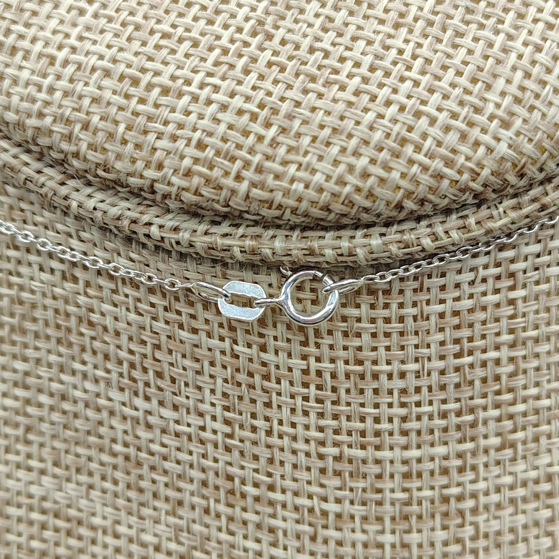 The clasp on this Sterling Silver necklace is a spring ring clasp