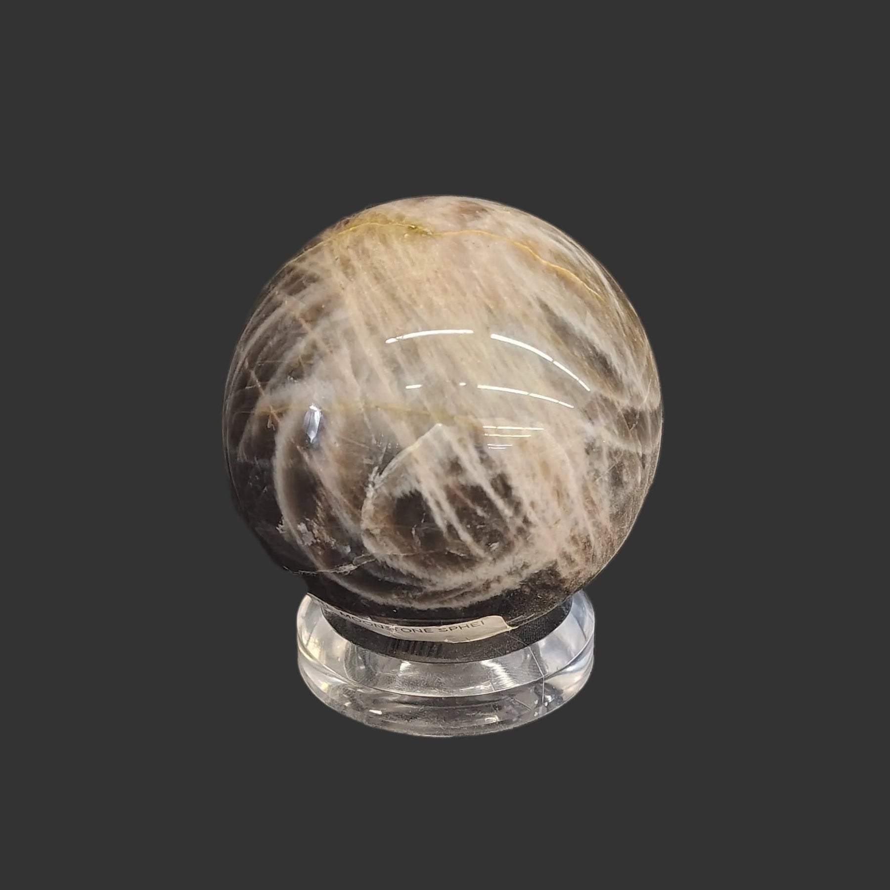 You can see in this picture how nicely this acrylic stand holds the black moonstone sphere.