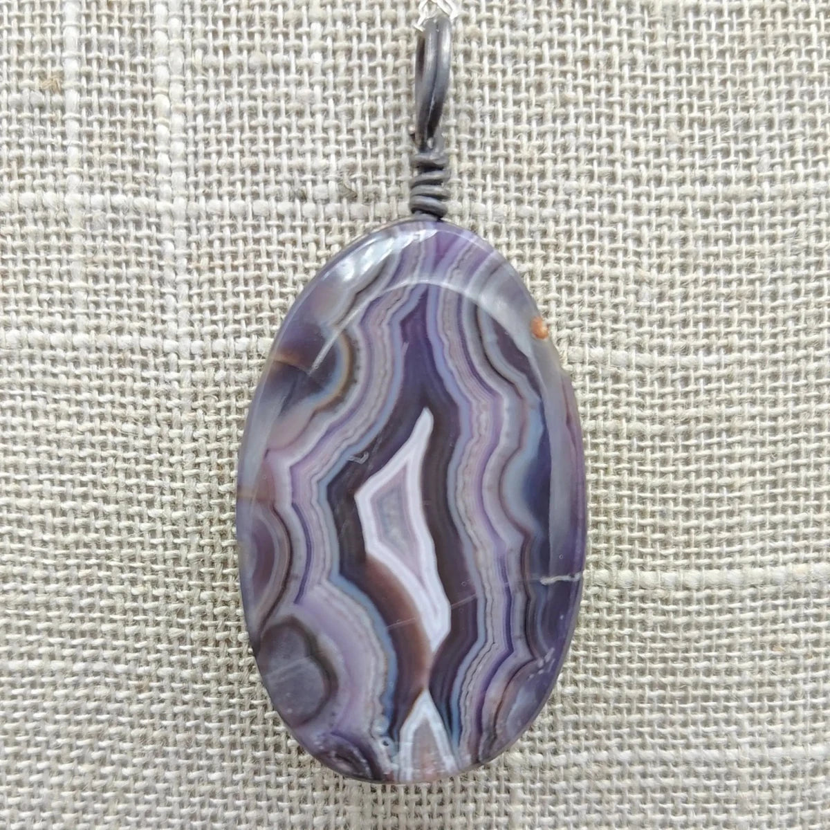 This is a close up the back side of this purple Agate pendant