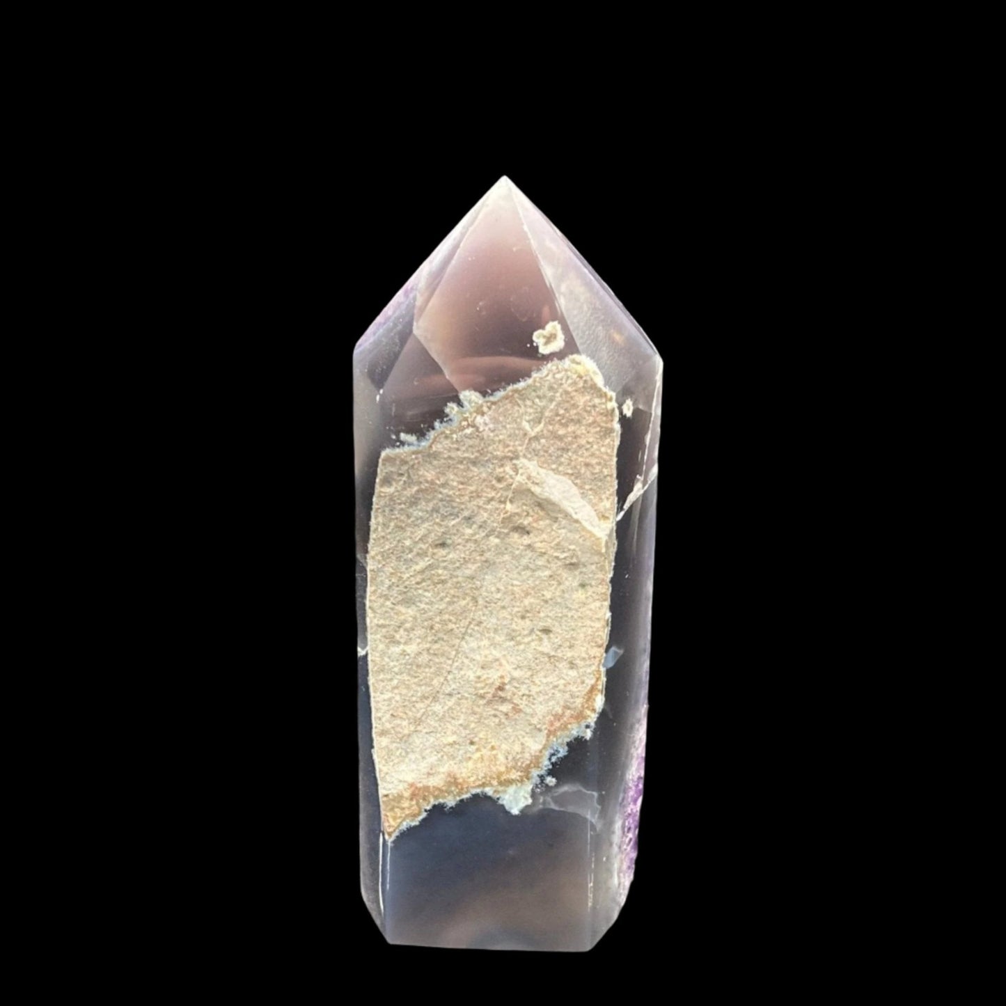 This is the back side of the Amethyst tower with Calcite. The top and bottom has been polished smooth, but the middle has been left raw.