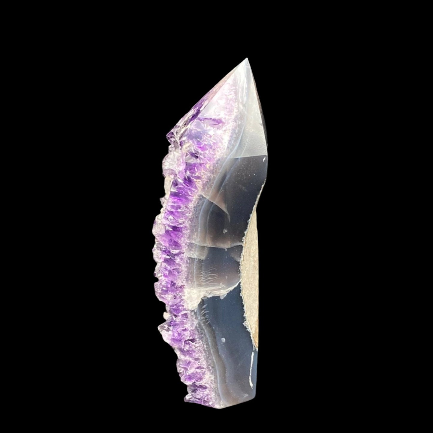 This is the left side of the Amethyst tower. You can see the side of the Amethyst and Calcite crystals.