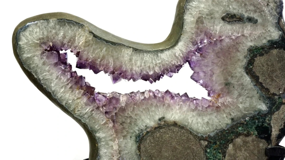 Close Up Of Amethyst Geode Slice Carved Stone 360 Rotating Black Stand
