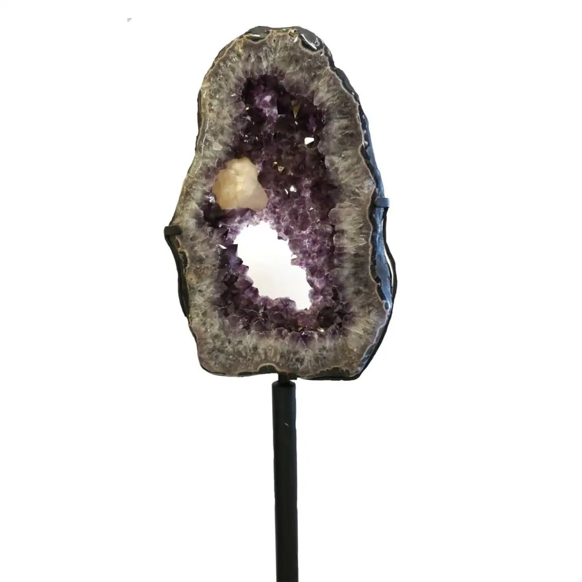 Geode with amethyst and calcite on a white background