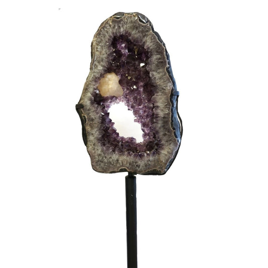 Geode with amethyst and calcite on a white background