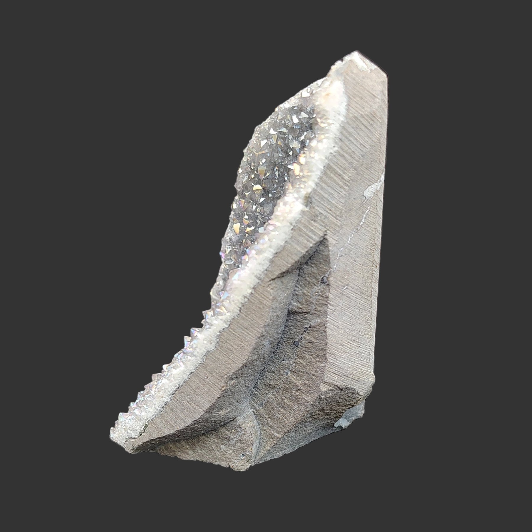 This is the left side of this angel aura amethyst crystal cluster