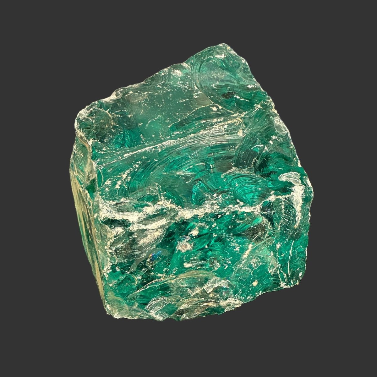 Single large chunk of aqua colored slag glass.