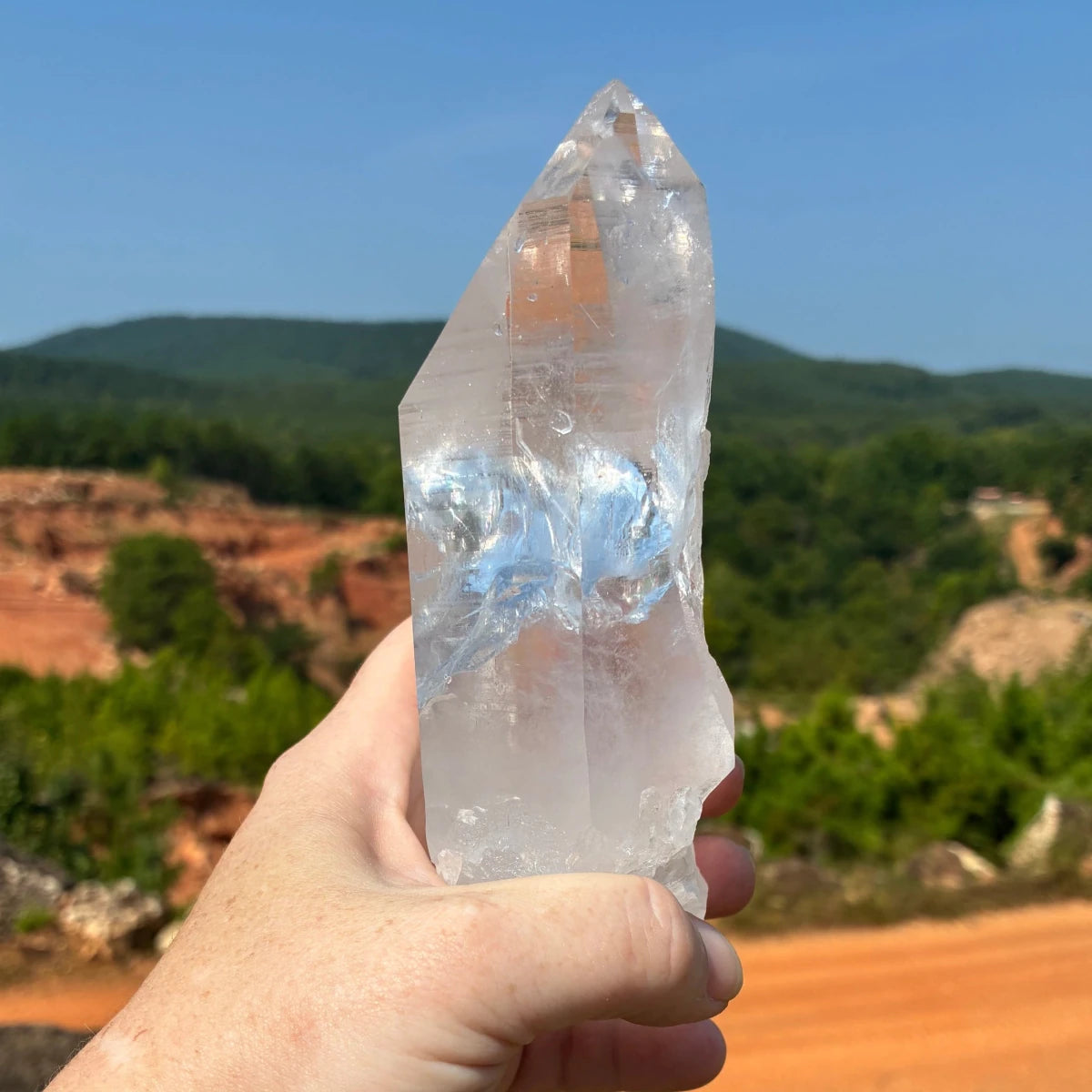This is the back side of this quartz crystal point, in the outdoors.
