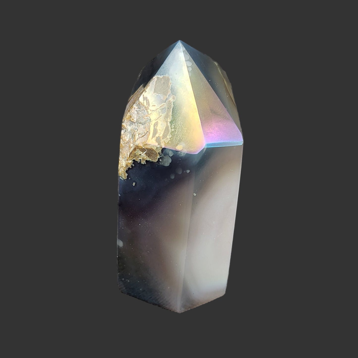 This is the right side of this aura coated crystal point.