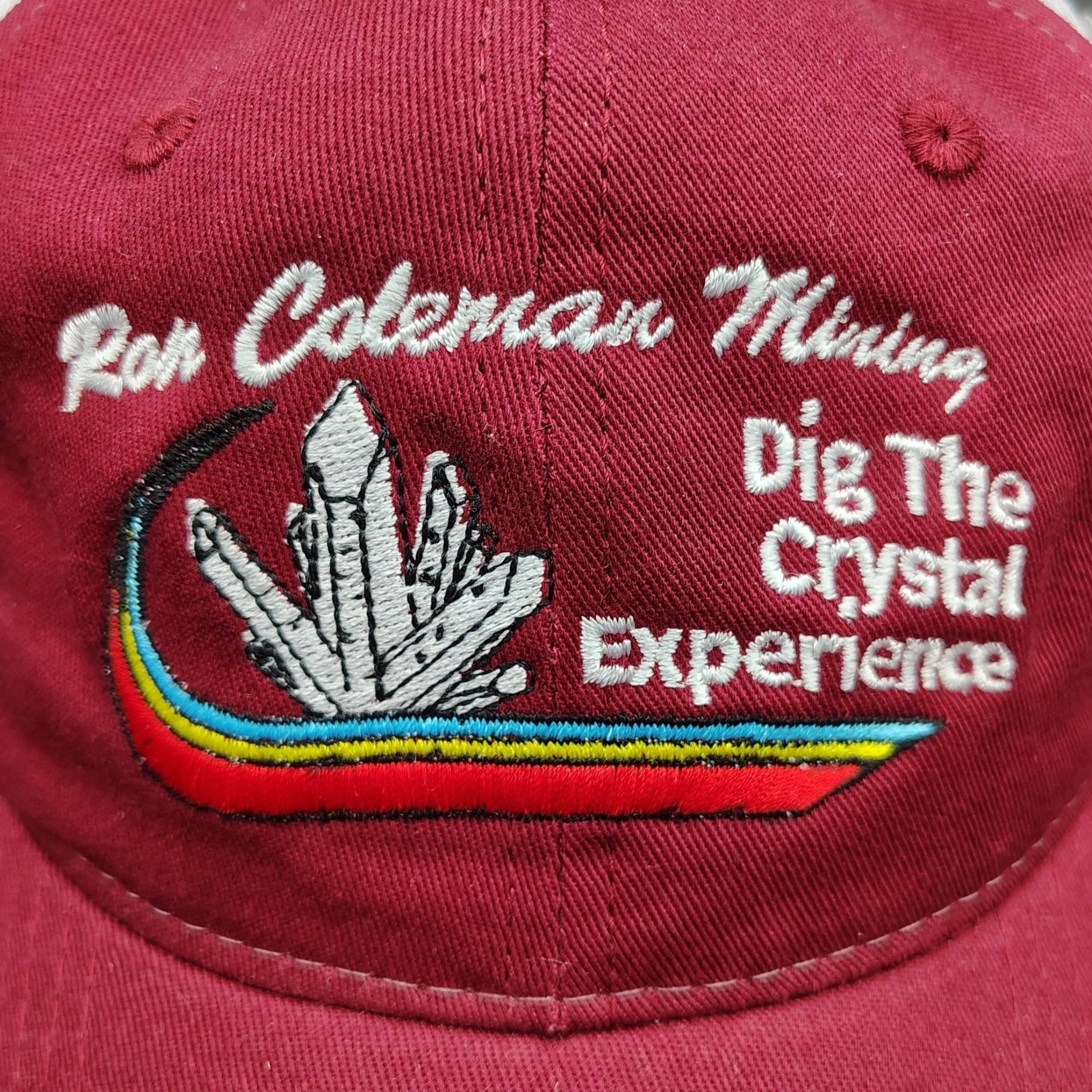 This is a close up of the design on the front of this burgundy hat