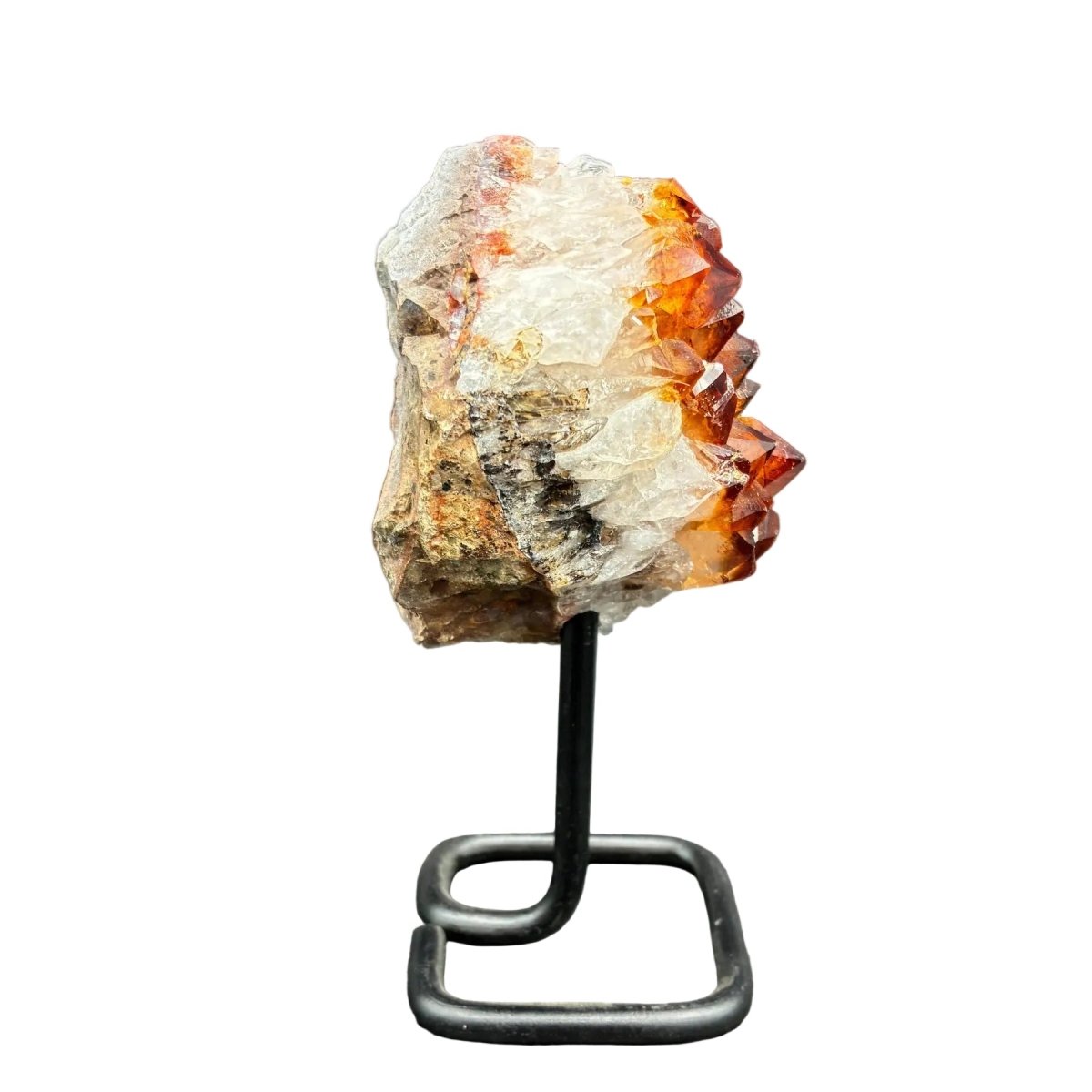 Right side of this Citrine cluster on stand, in front of a white background.