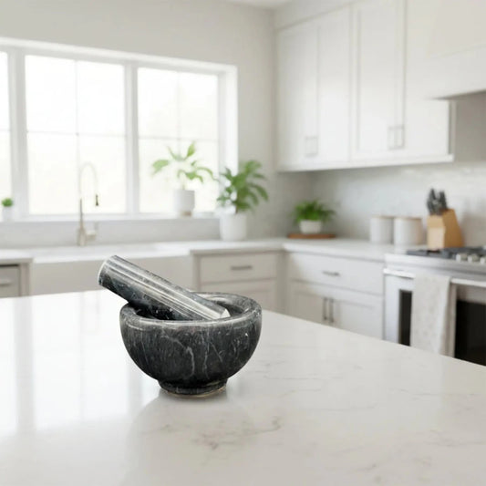 Black Onyx Mortar And Pestle Kitchen Decor on a kitchen counter.