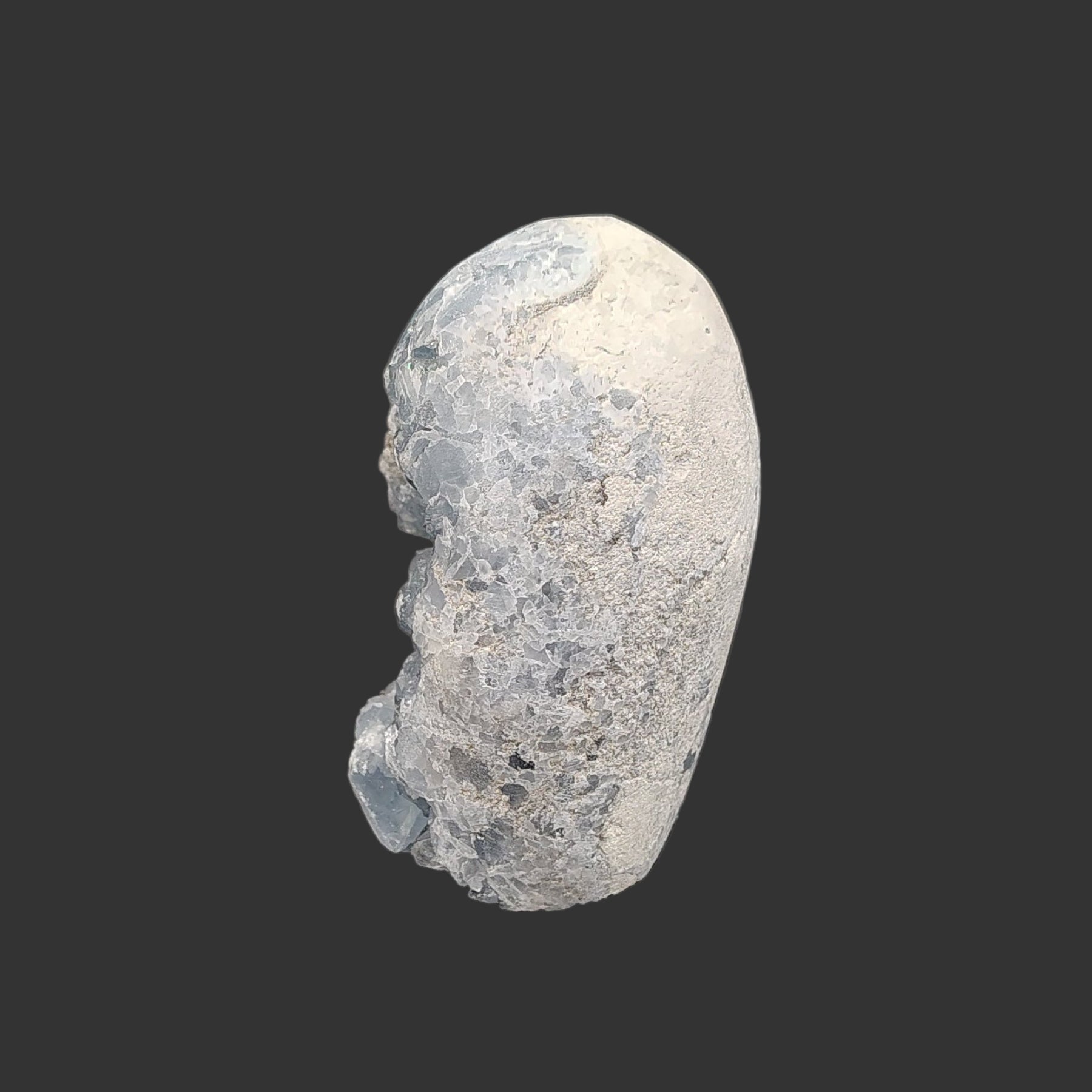 The left side of this blue celestite crystal geode is left smooth and natural.