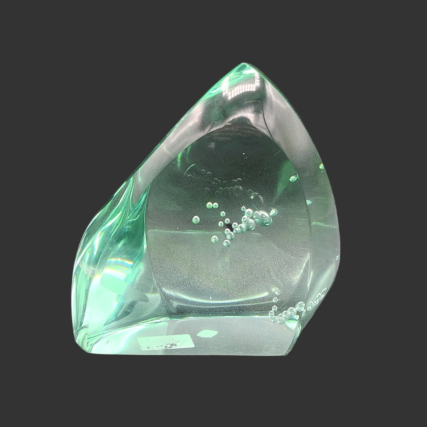 This is the back side of this polished blue green volcanic obsidian glass.
