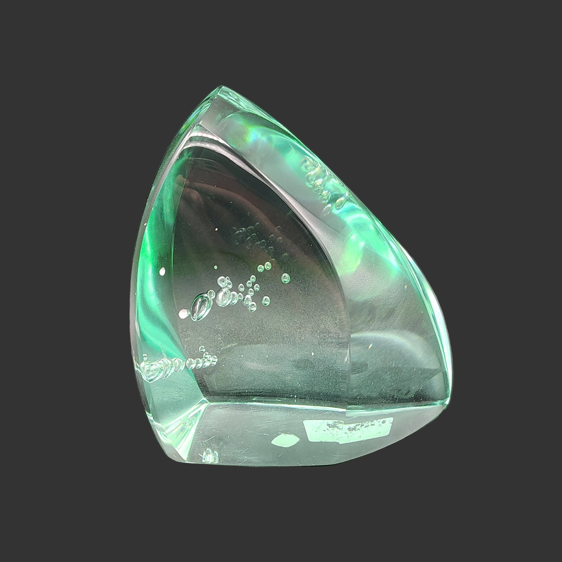 This is the front side of this blue green polished volcanic glass free form.