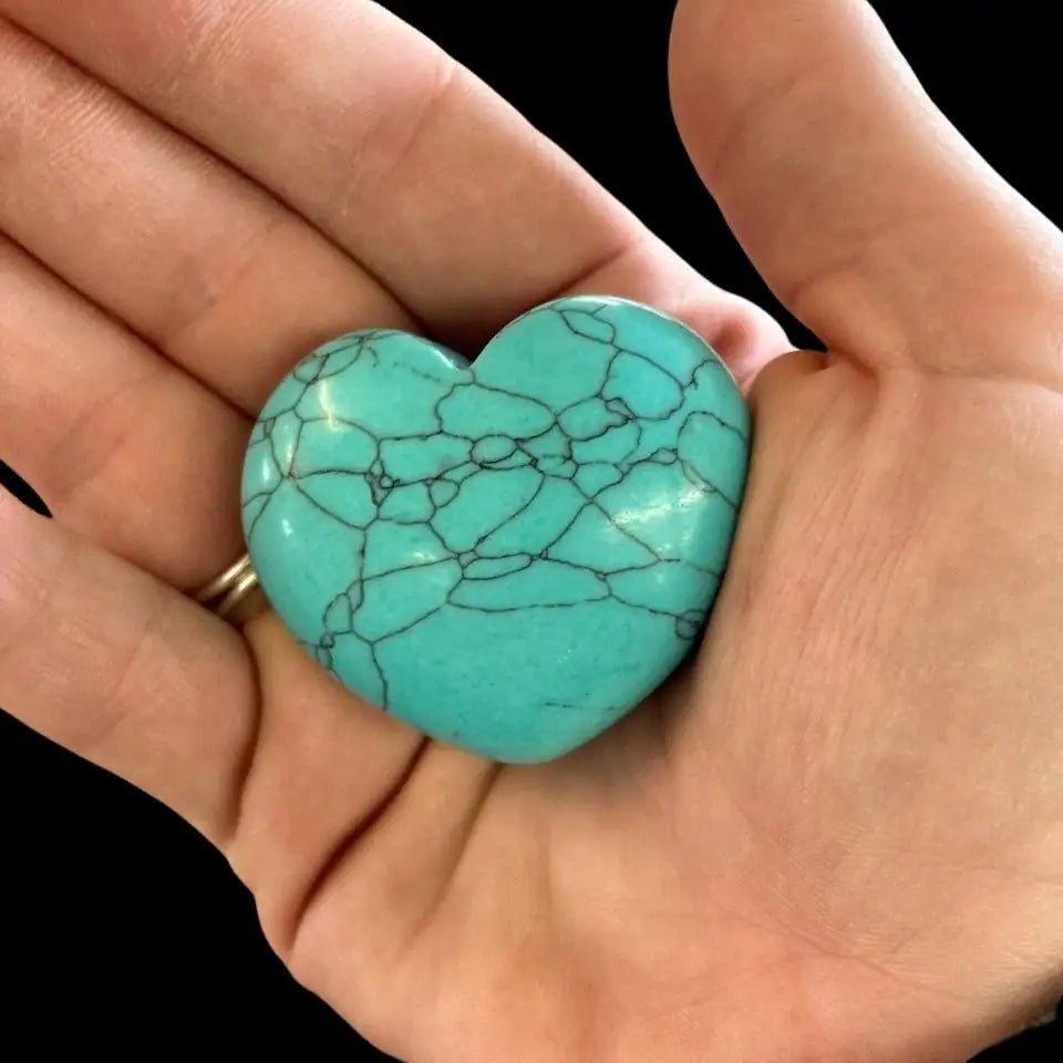 Blue Howlite Heart being held in an open hand