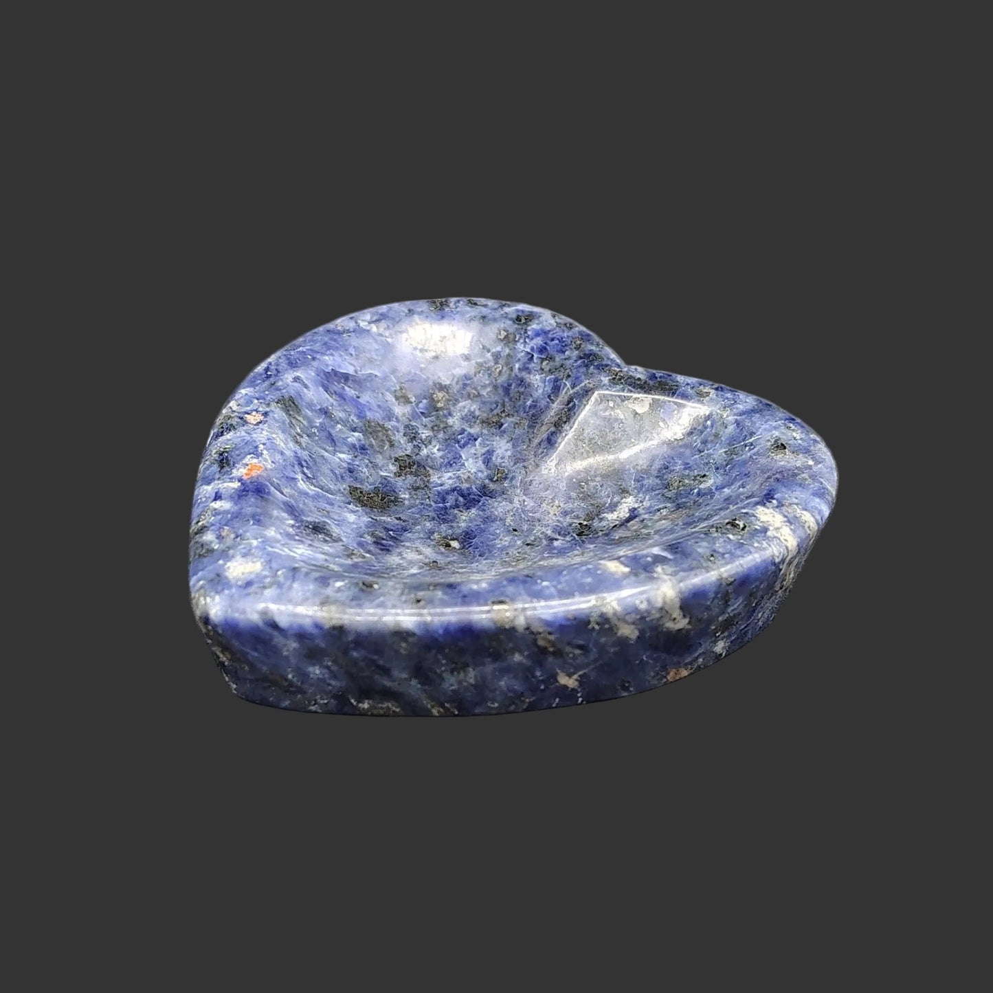 This is what this polished heart-shaped blue sodalite trinket bowl looks like from the side.