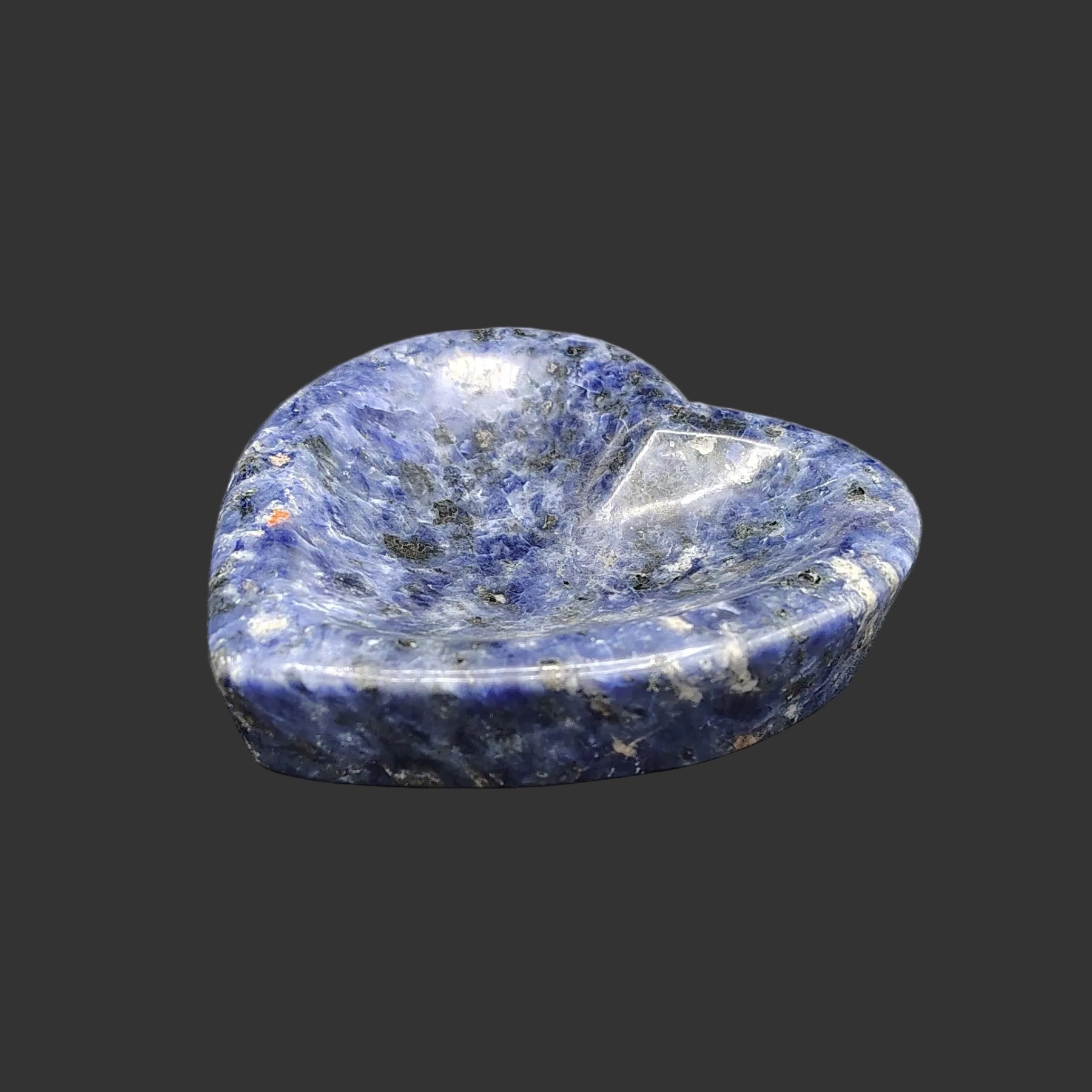 This is what this polished heart-shaped blue sodalite trinket bowl looks like from the side.