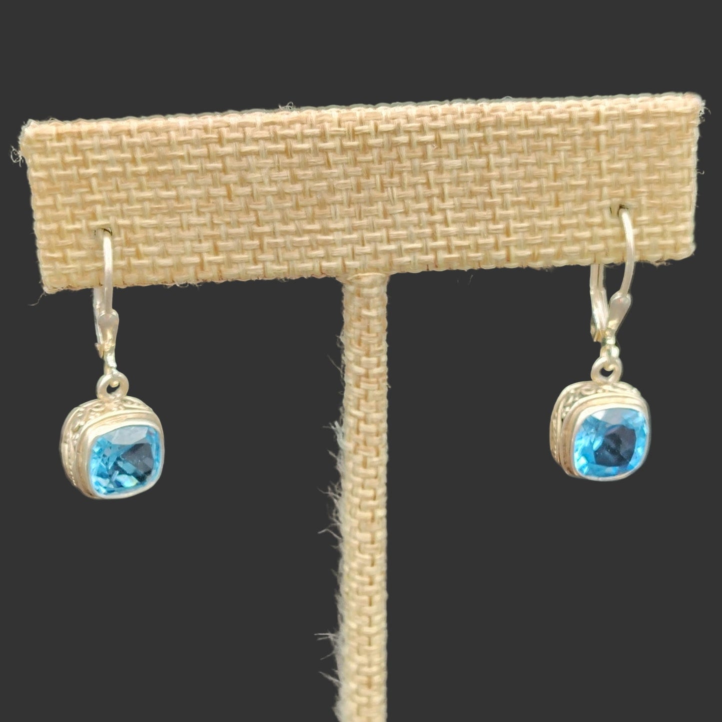 This is a close up of the blue topaz gemstones and the setting