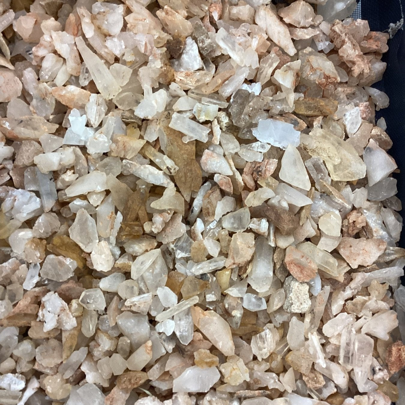 Close-up of small rocks and crystals with a dark background