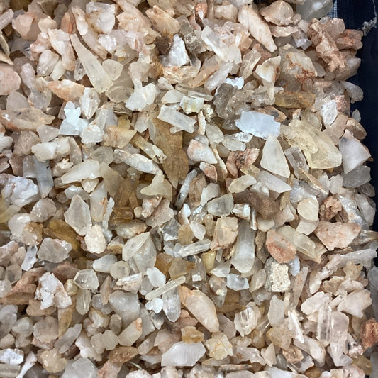 Close-up of small rocks and crystals with a dark background