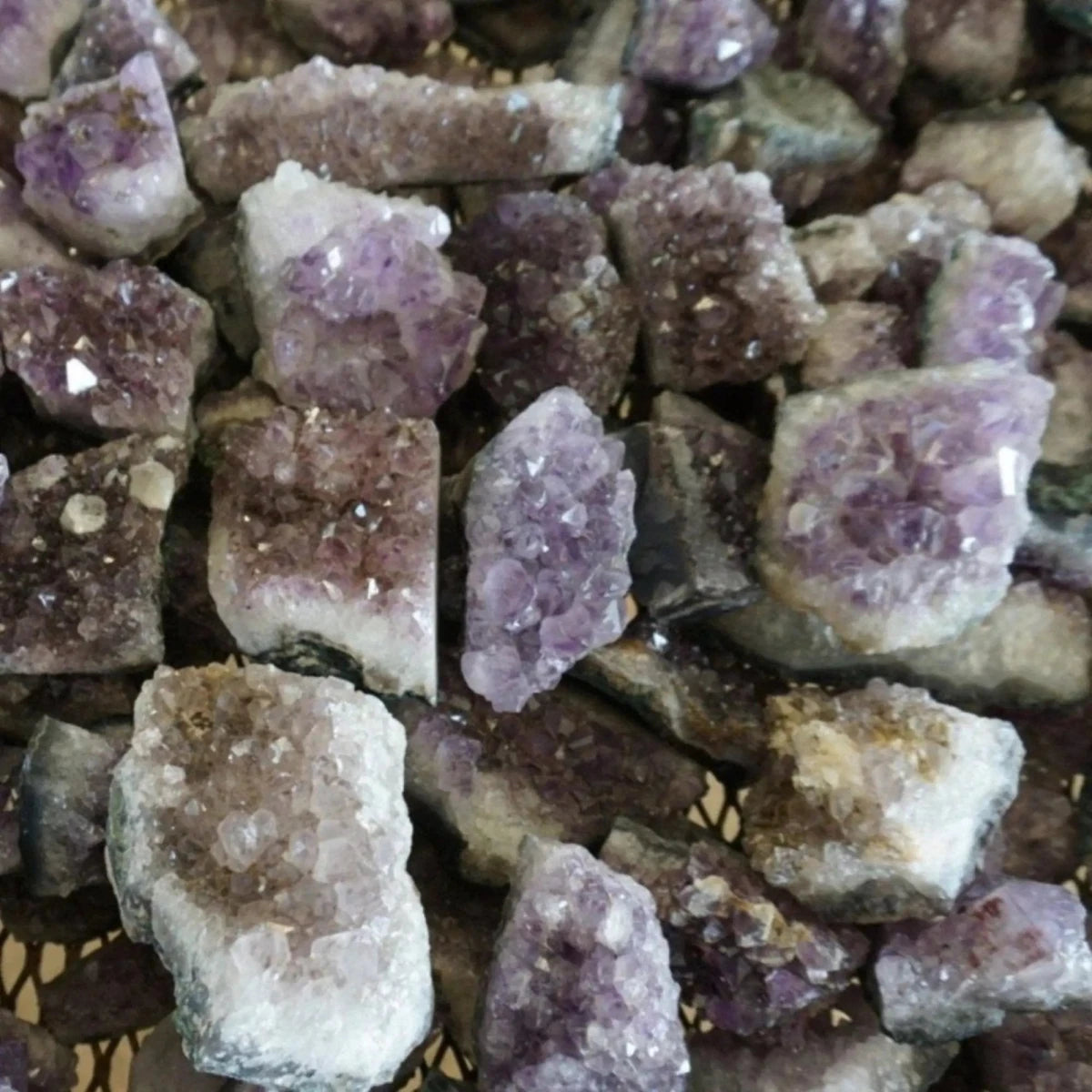 Table filled with Bulk Amethyst Raw Dark Purple