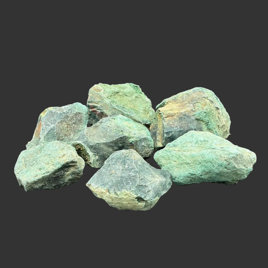 Close up of a group of 7 green bloodstone specimens.