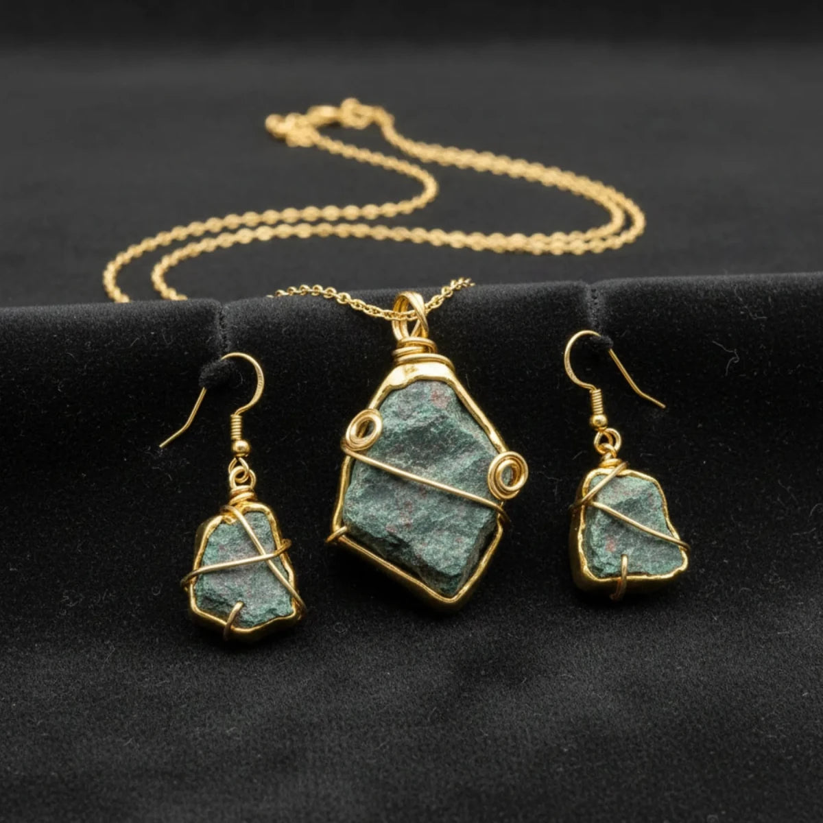 Gold wire wrapped raw green bloodstone earrings and necklace.