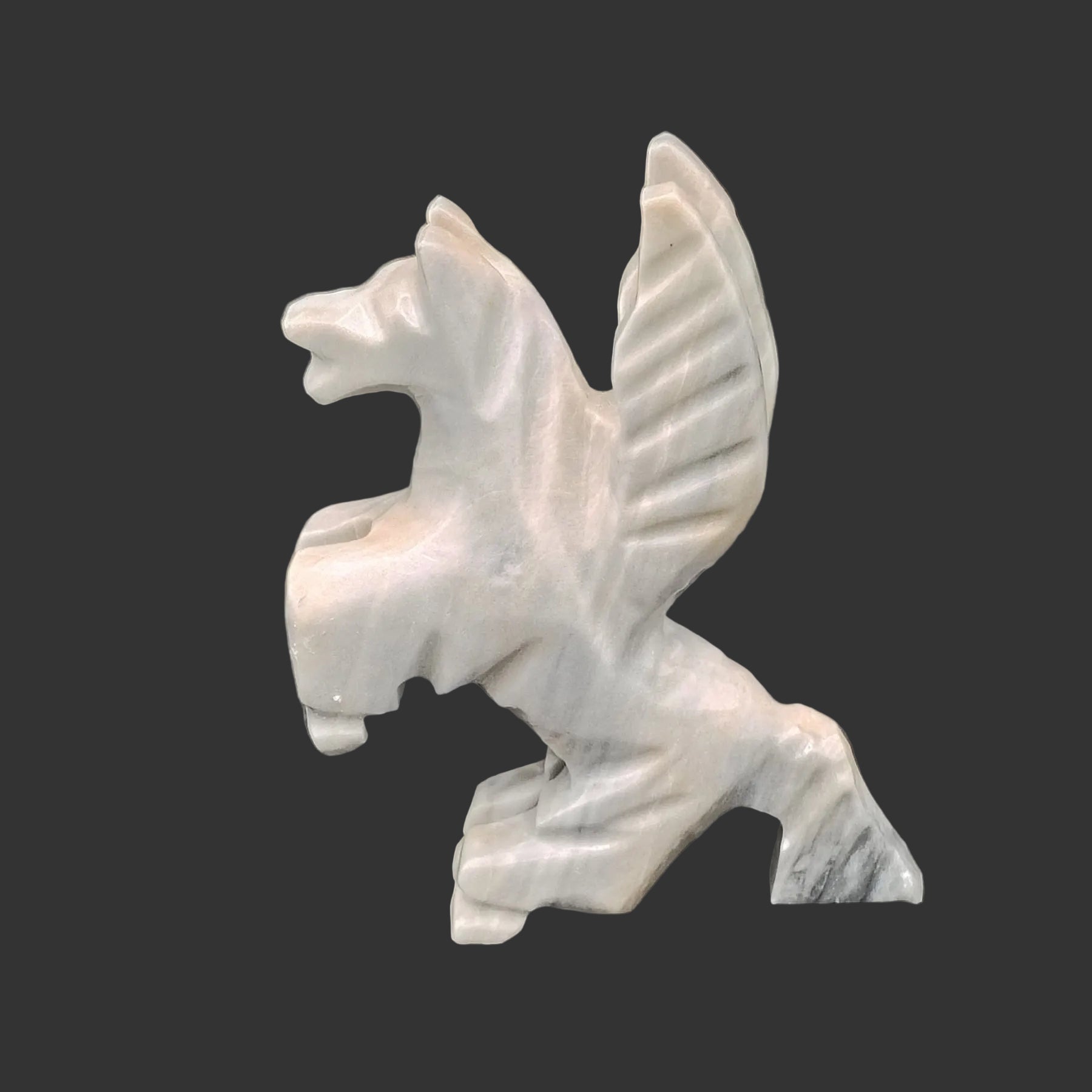 This is the left side view of this grey and beige flying horse in the standing up position.