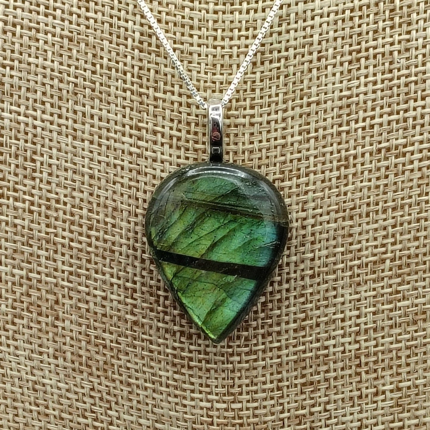 This is a close up of the rain drop labradorite pendant