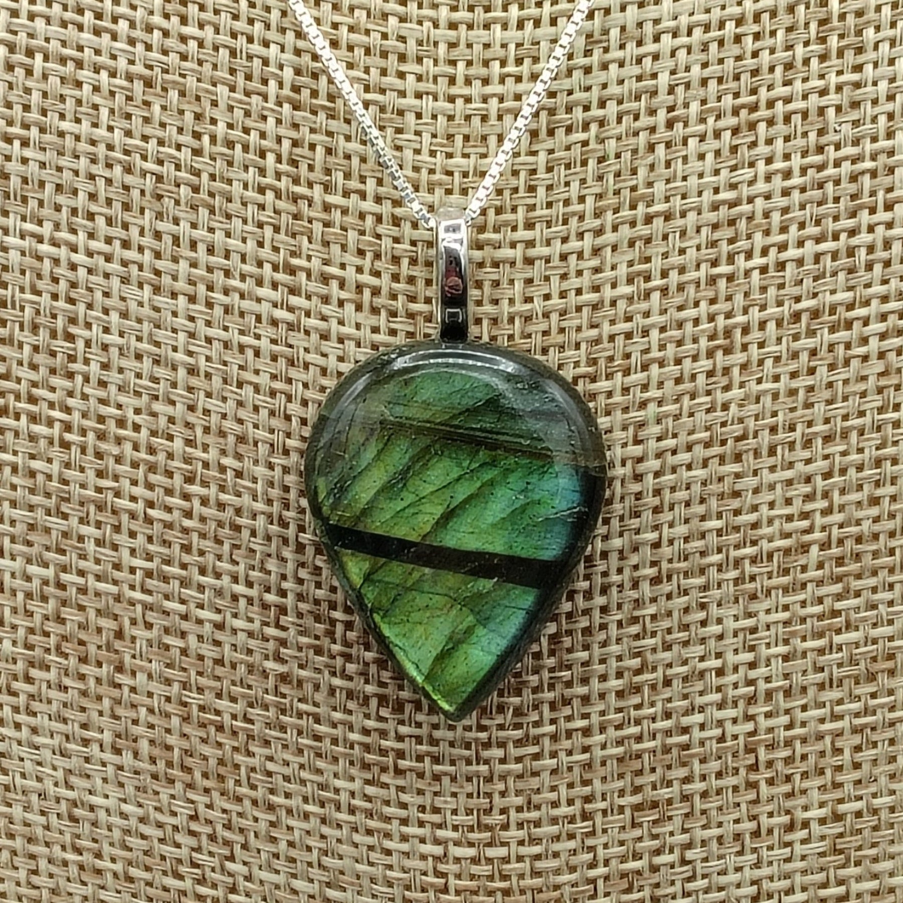 This is a close up of the rain drop labradorite pendant