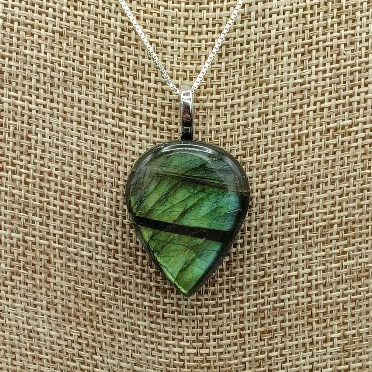 This is a close up of the rain drop labradorite pendant