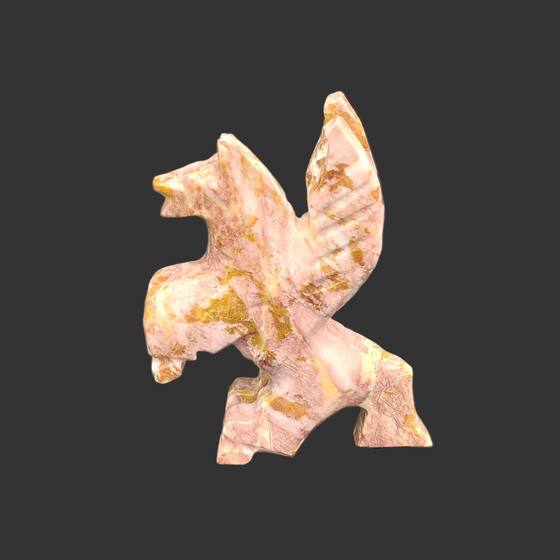 This is the left side of this hand carved strawberry and brown Onyx Pegasus standing up.