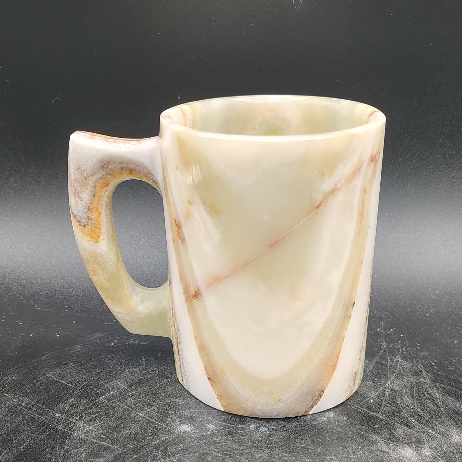 This is the right side of this Onyx mug, mostly cream, with some brown and green.