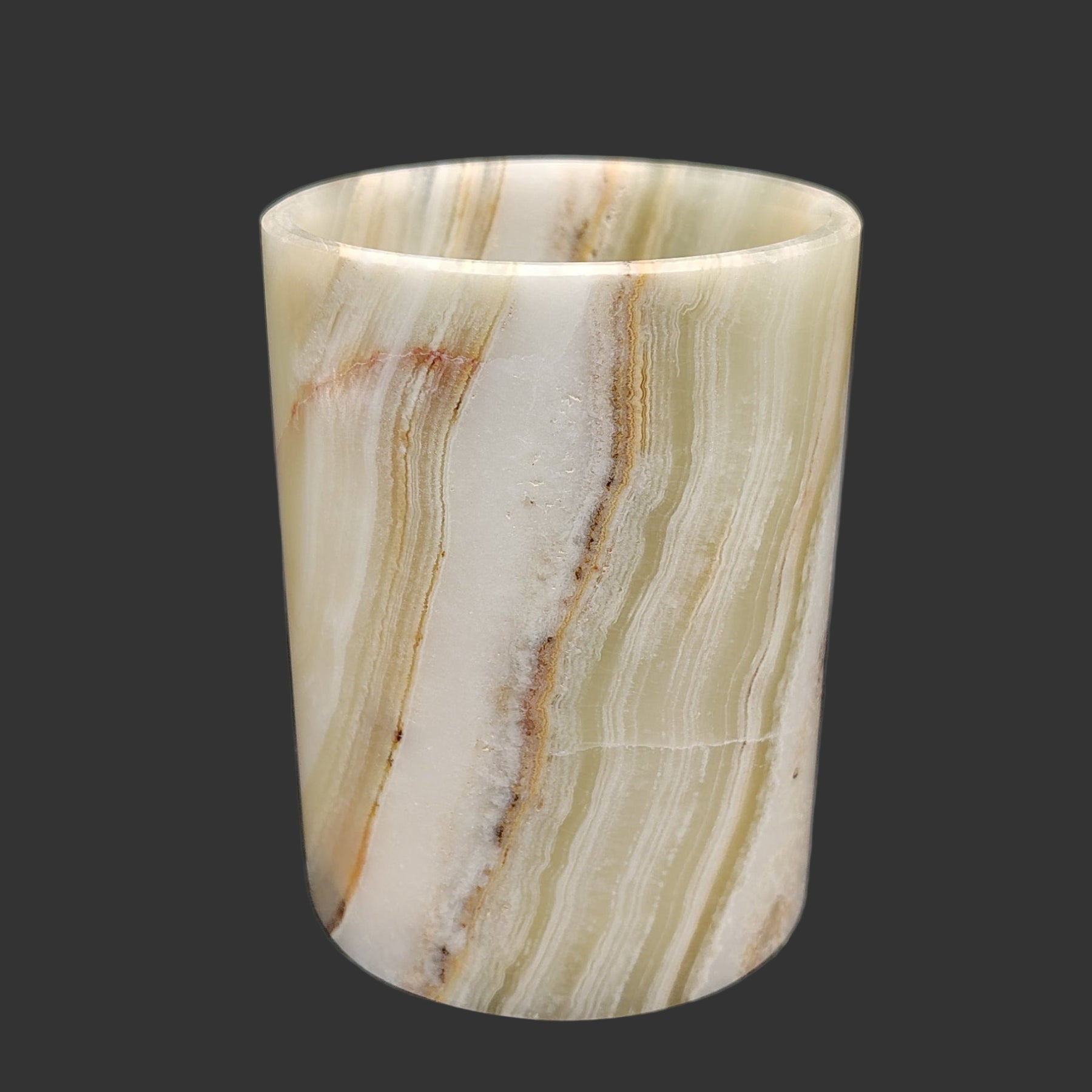 This is the front view of this Onyx mug. It has banding of green, brown, orange, and cream Onyx.
