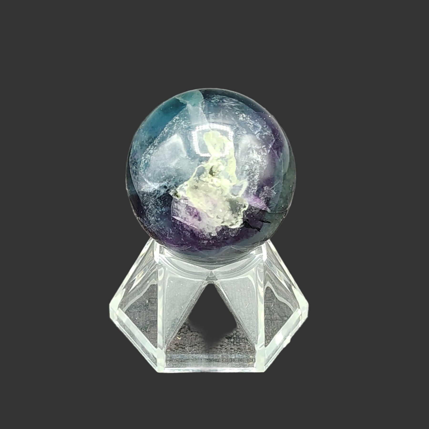 This is the front view of this small polished fluorite sphere
