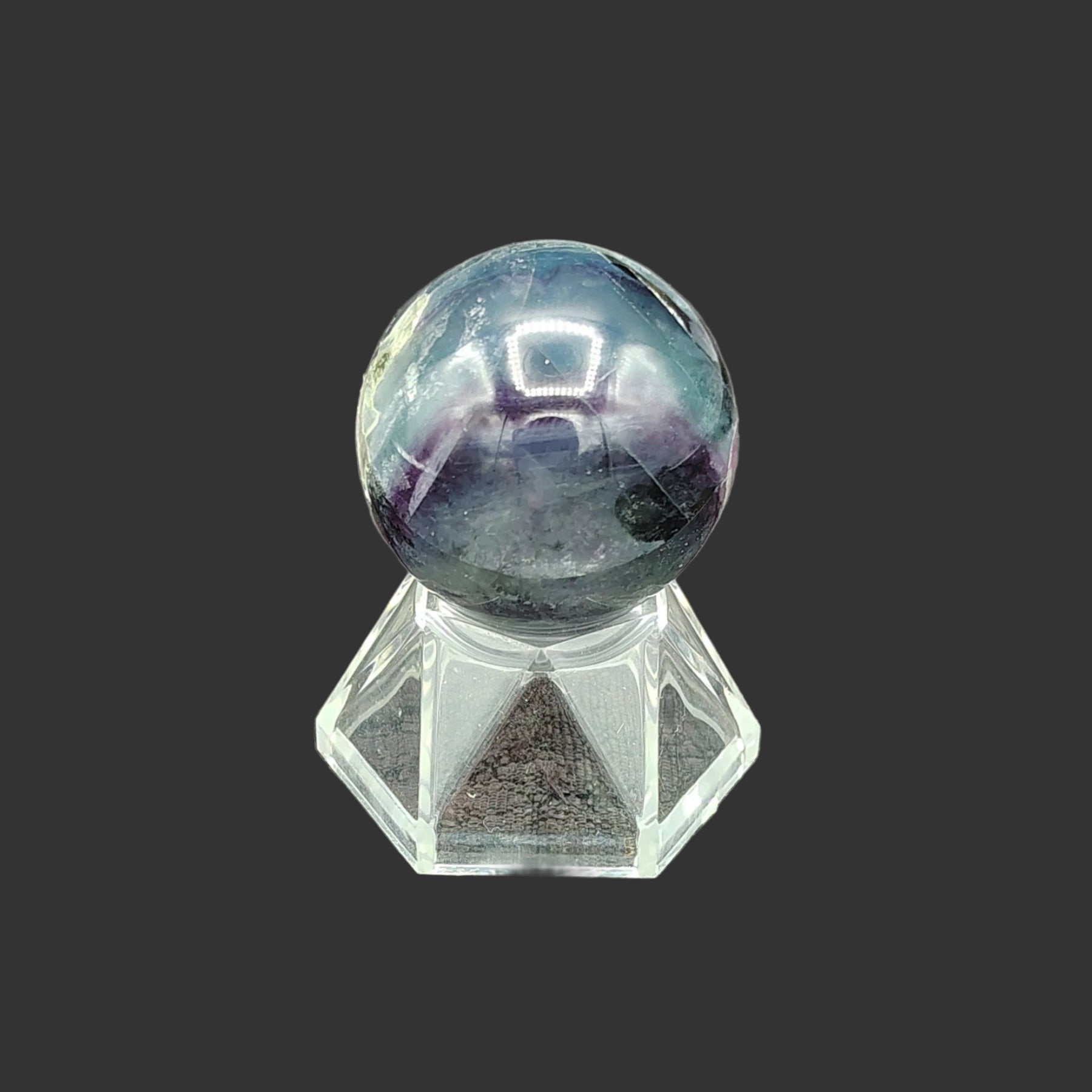 This is the left side view of this polished fluorite sphere