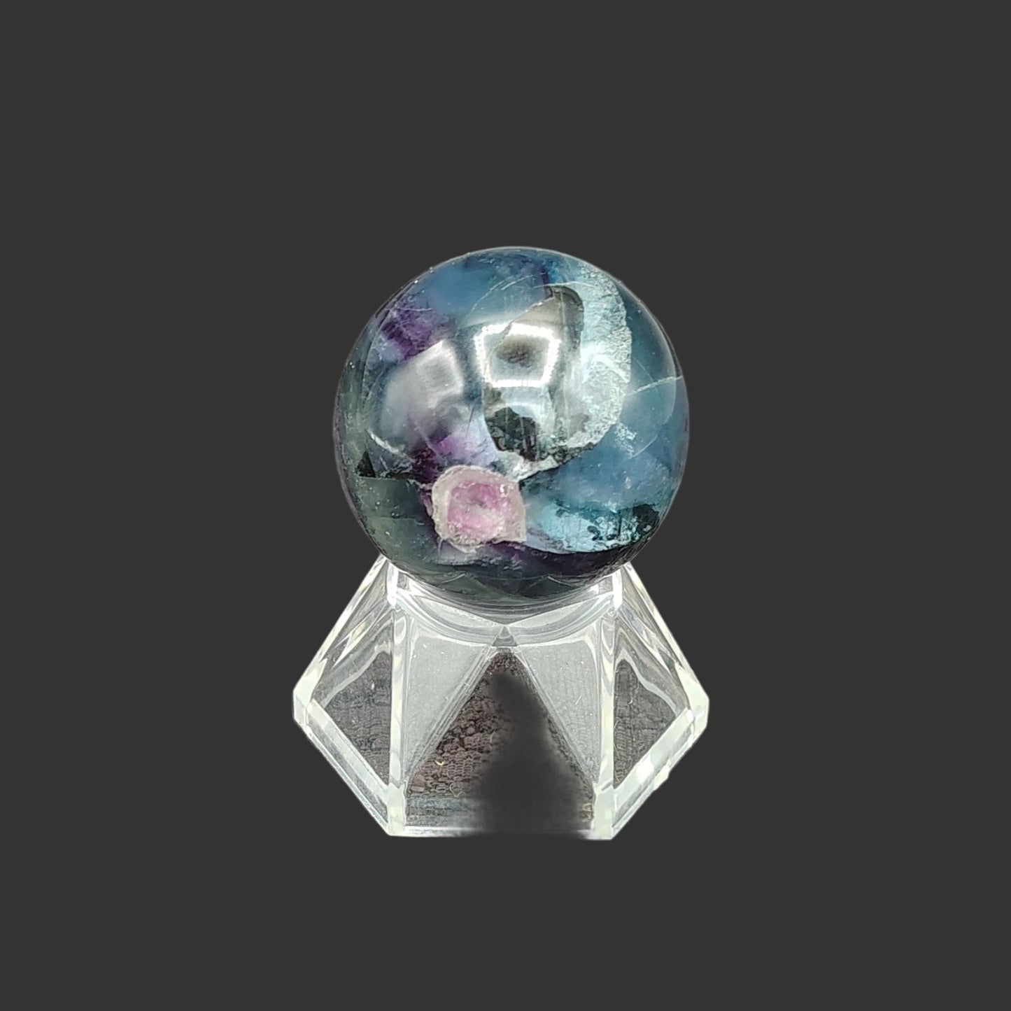 This is the back side of this polished fluorite sphere