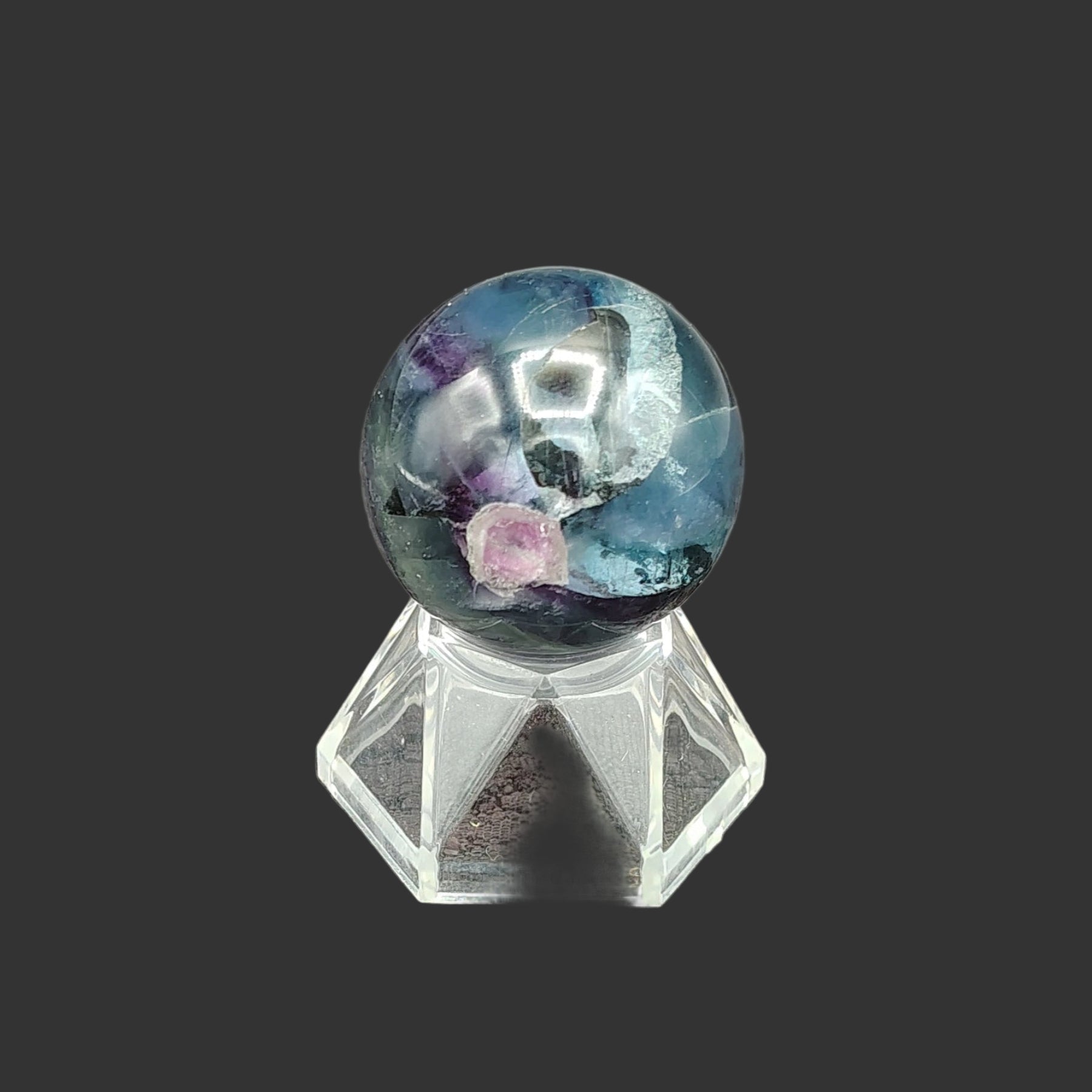 This is the back side of this polished fluorite sphere