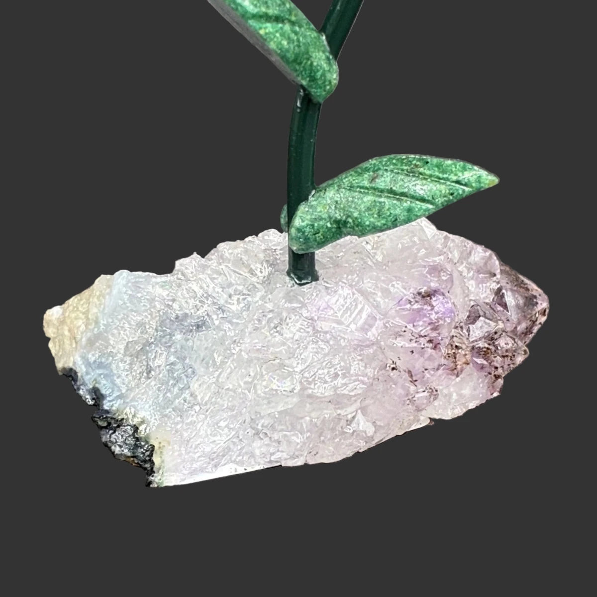 Close up of the amethyst base, in front of a black bacfkground.