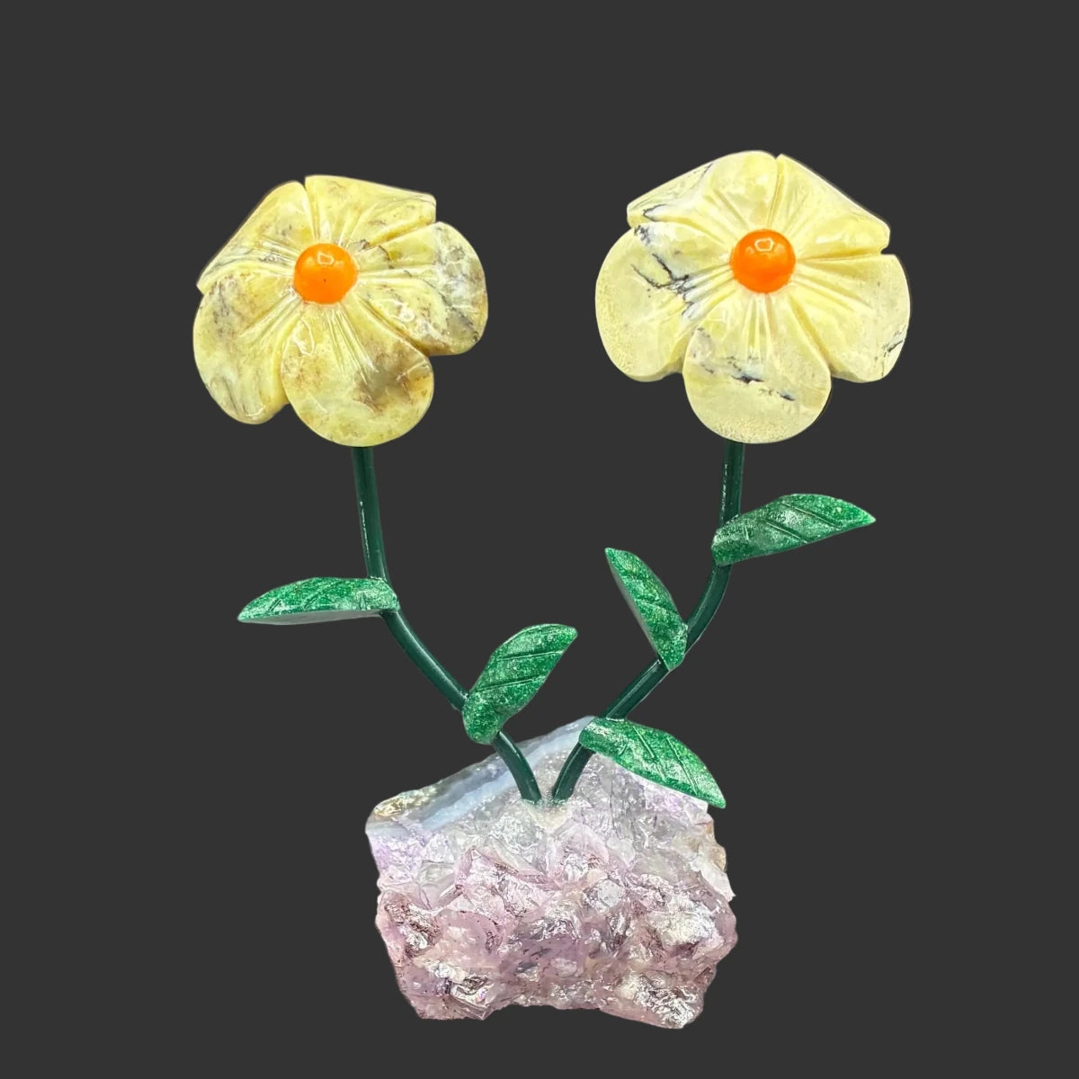 Front side of this green opal double daisy flower on a amethyst base, in front of a black background.