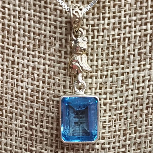 This is a close up of the Sterling Silver and blue Topaz pendant